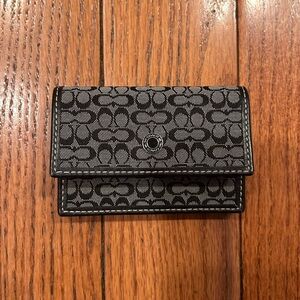 Tiny coach wallet